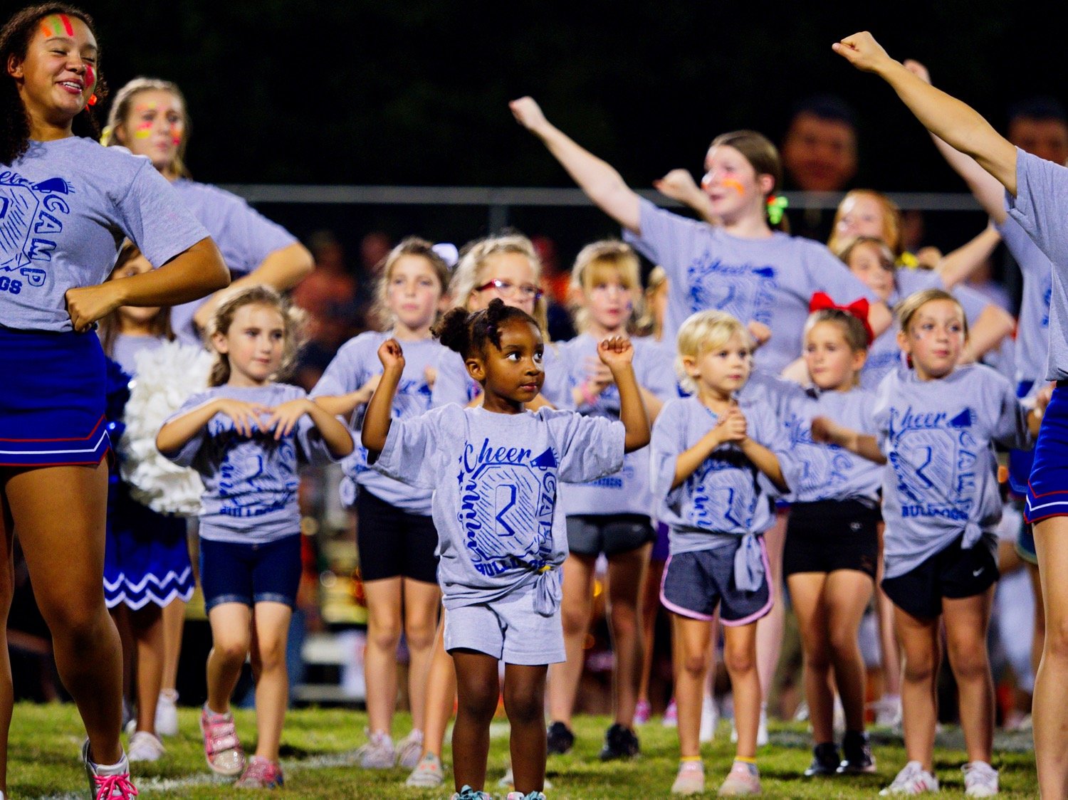 Participants of the Quitman varsity cheerleaders' mini-camp show off their new moves during halftime. [catch more cheer-worthy captures]